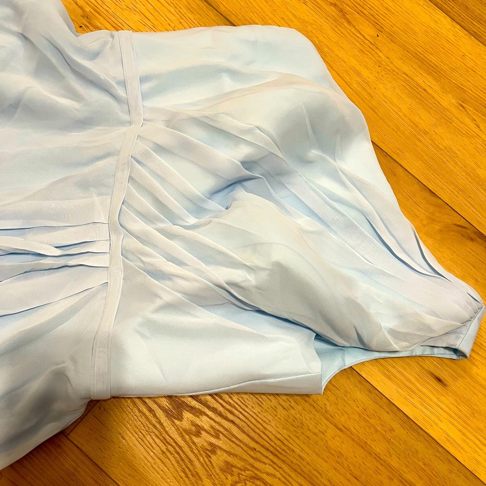 Beautiful one shoulder formal. Light blue. Never worn. New without tags.